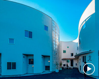 curved residential development shapes a vibrant 'pocket' in japanese cityscape