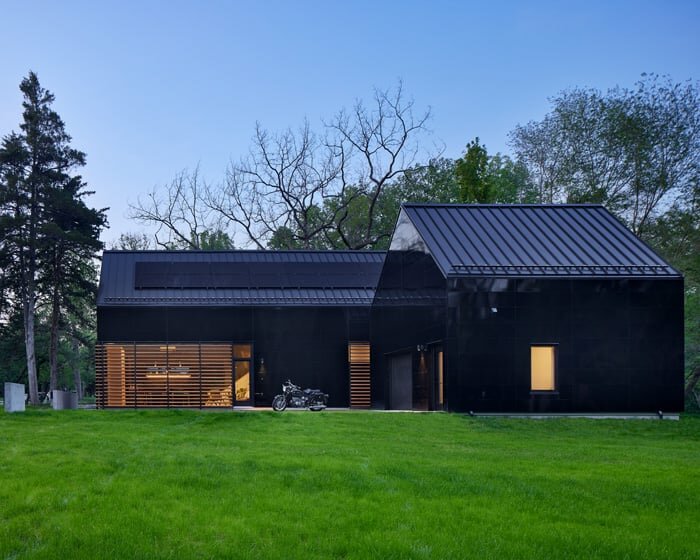 black reflective recyclable cladding coats pinkney neighborhood house in kansas
