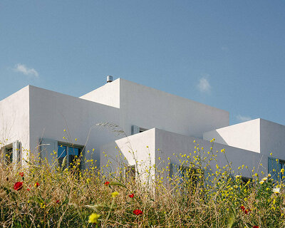 sigurd larsen sculpts interconnected cubes for single house on rocky greek island