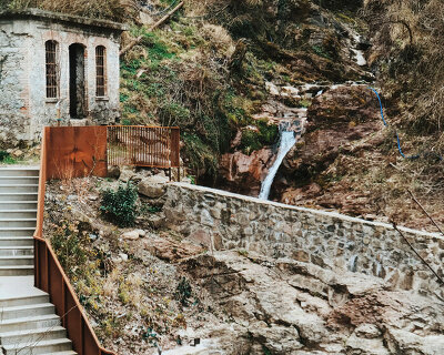 corten steel and stone components revamp collapsed open washhouse in italy