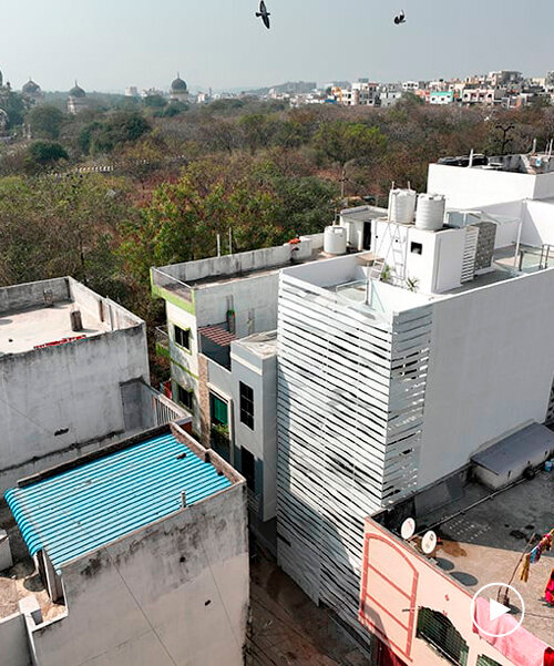 folded steel ribbons envelope narrow row house in india