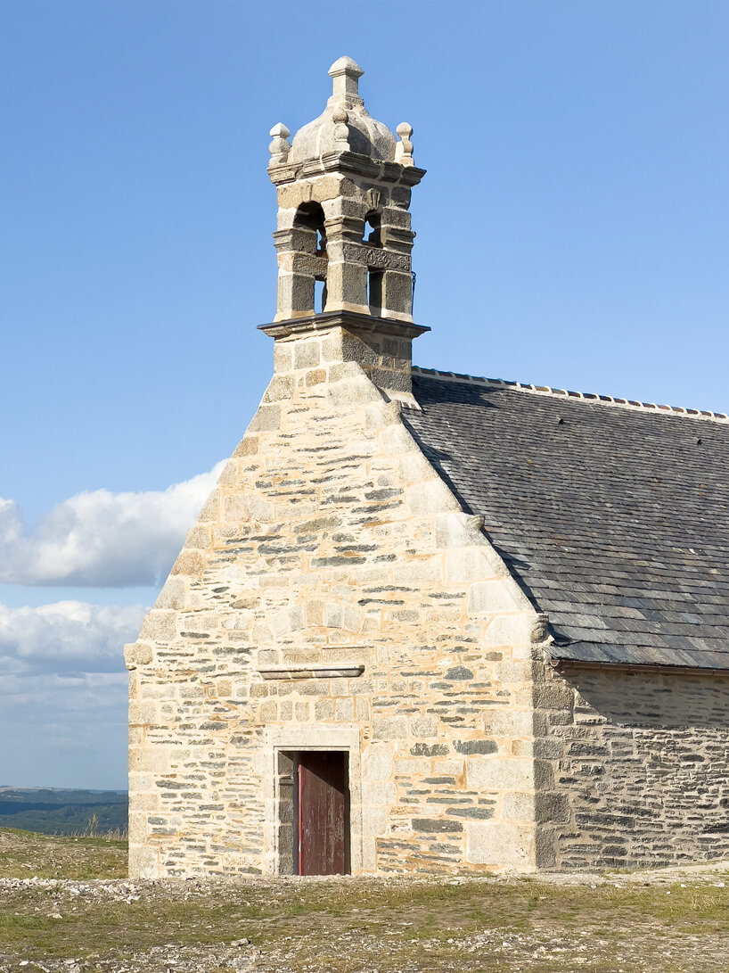 ronan bouroullec adorns restored chapel in monts d'arréel with minimal stone-sculpted altar
