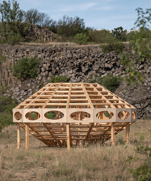spaceship earth timber installation lands at hello wood festival in hungary
