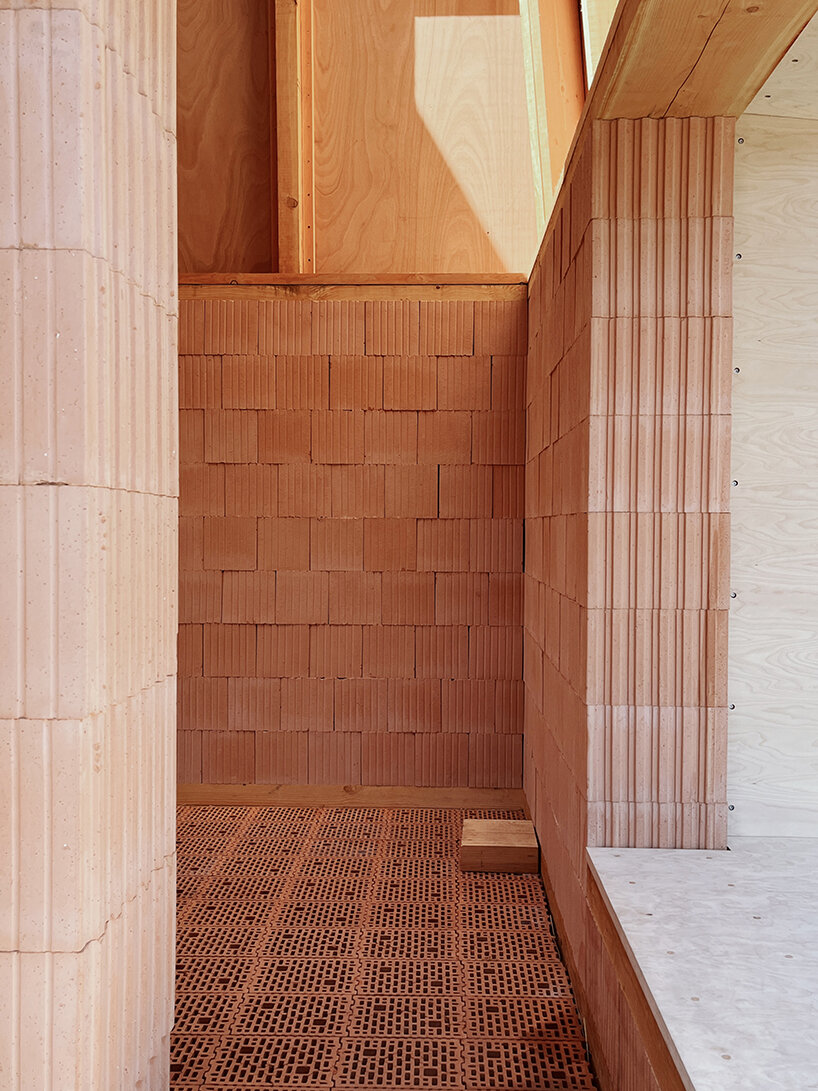 low-carbon & fire-resistant pavilion in copenhagen features a thatched brick shell