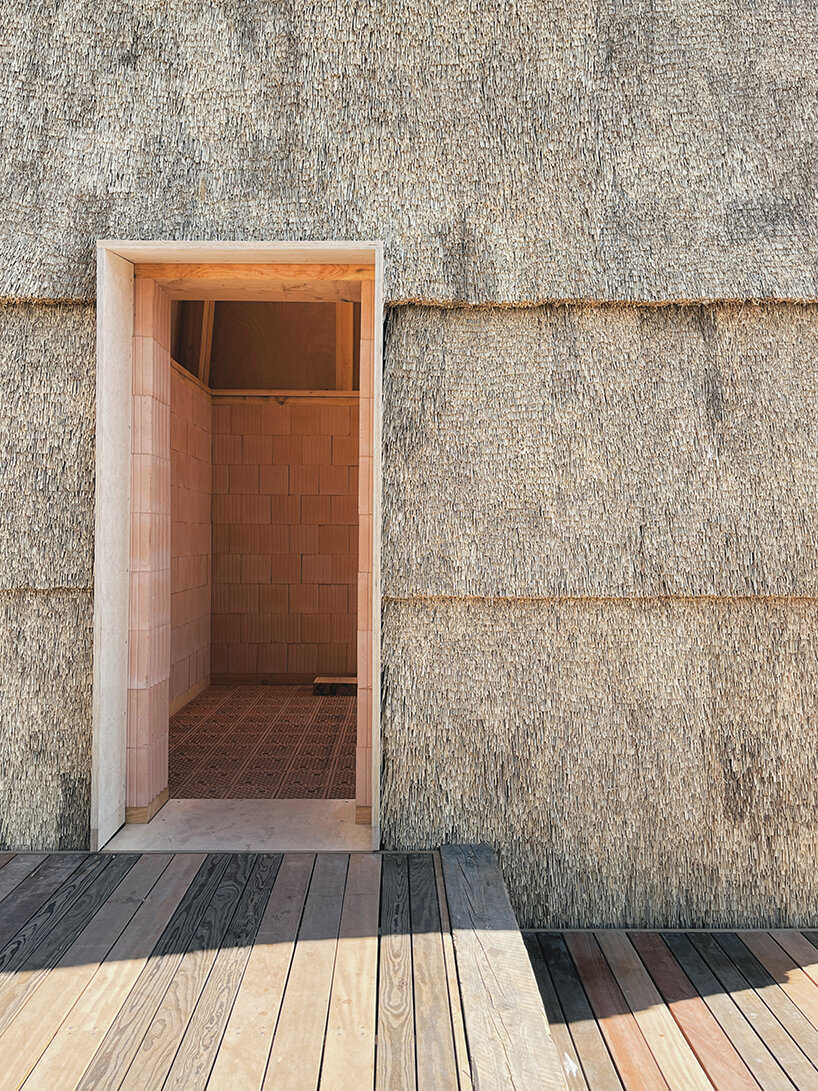 low-carbon & fire-resistant pavilion in copenhagen features a thatched brick shell