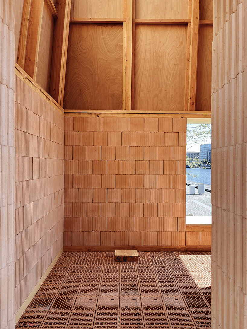 low-carbon & fire-resistant pavilion in copenhagen features a thatched brick shell