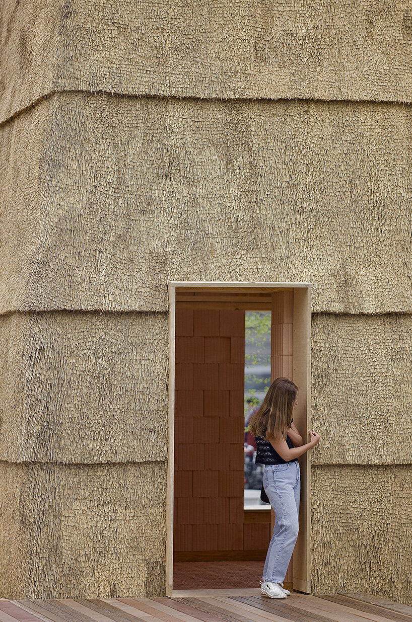 low-carbon & fire-resistant pavilion in copenhagen features a thatched brick shell