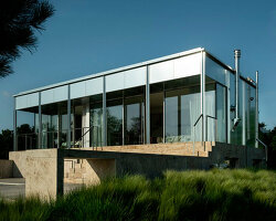 reflective aluminum framework crowns the clifftop house by KONTEXTUS in hungary