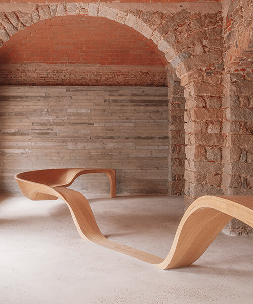 amelia tavella's curvilinear furniture-sculpture hybrid twists from seat to desk