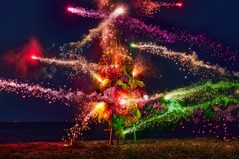 azuma makoto s botanical sculpture blossoms amidst colorful fireworks