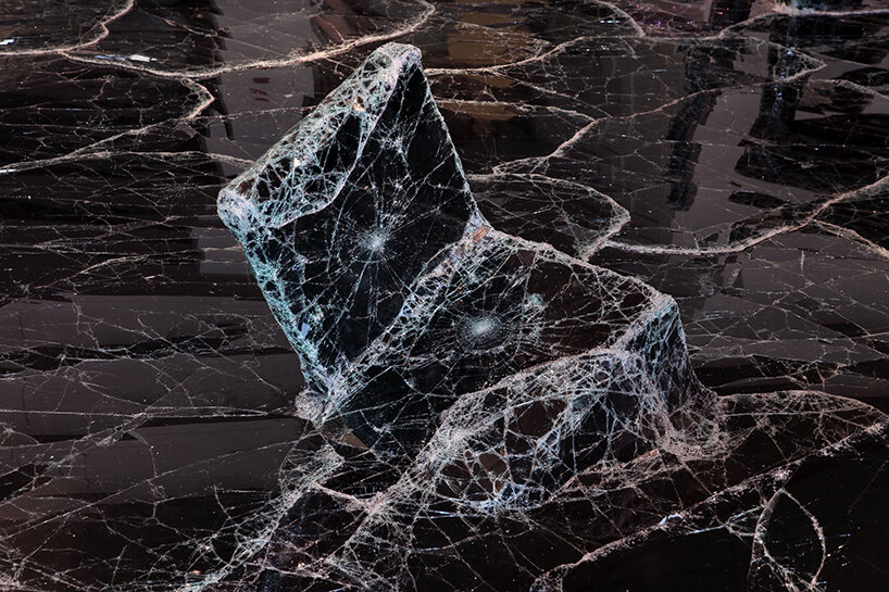 dark tide: baptiste debombourg recreates a magma flow disaster using broken black glass