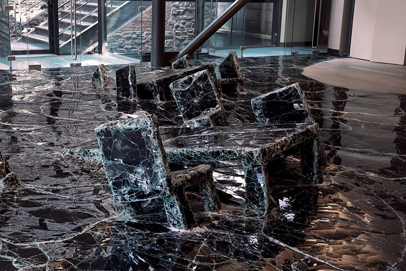 dark tide: baptiste debombourg recreates a magma flow disaster using broken black glass