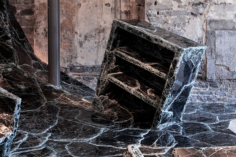 dark tide: baptiste debombourg recreates a magma flow disaster using broken black glass
