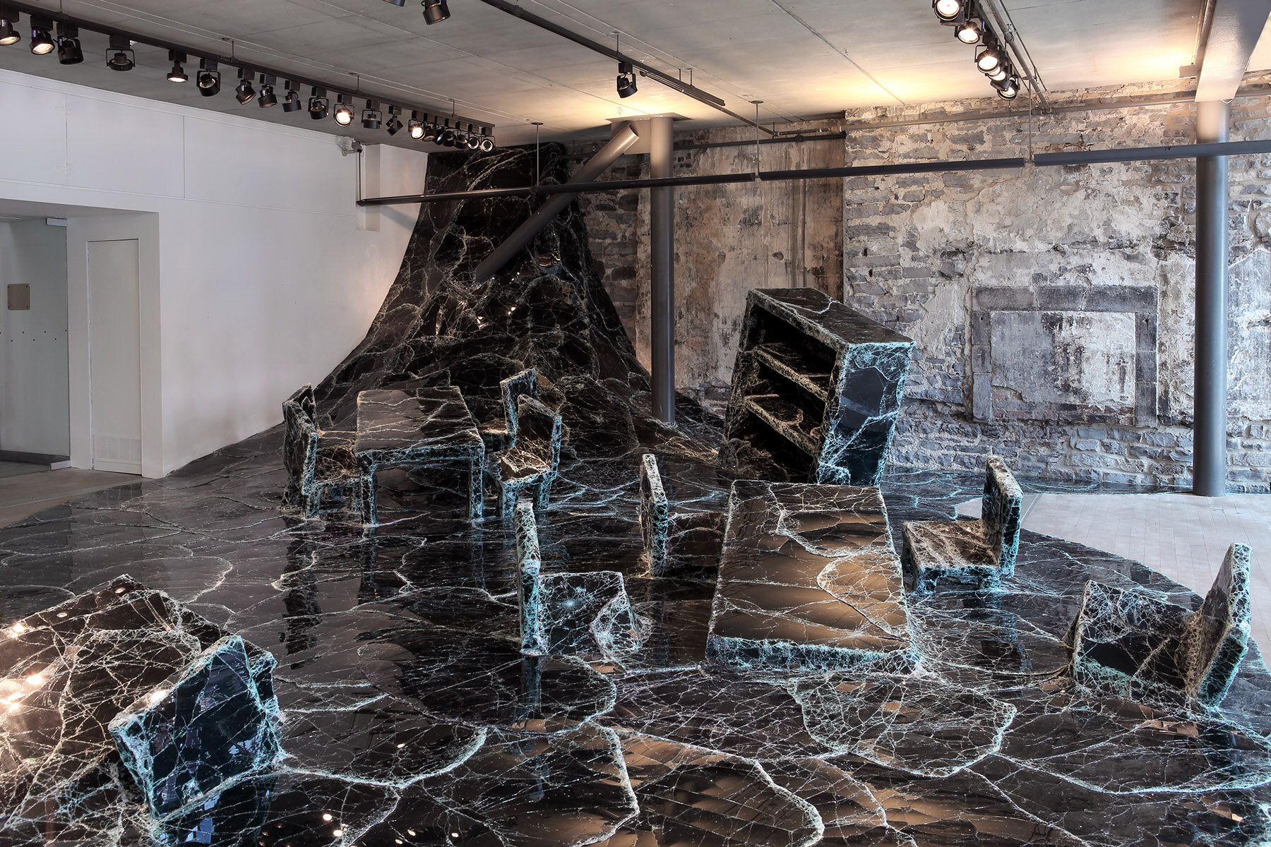 dark tide: baptiste debombourg's broken black glass installation