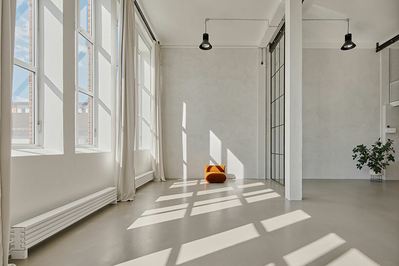 step inside the minimalist interior of hamburg-based kju.studio, captured by david altrath