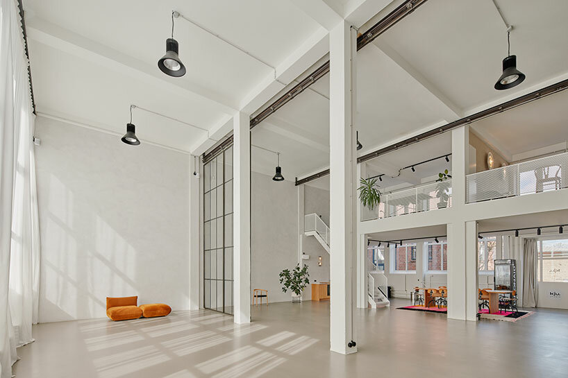 step inside the minimalist interior of hamburg-based kju.studio, captured by david altrath