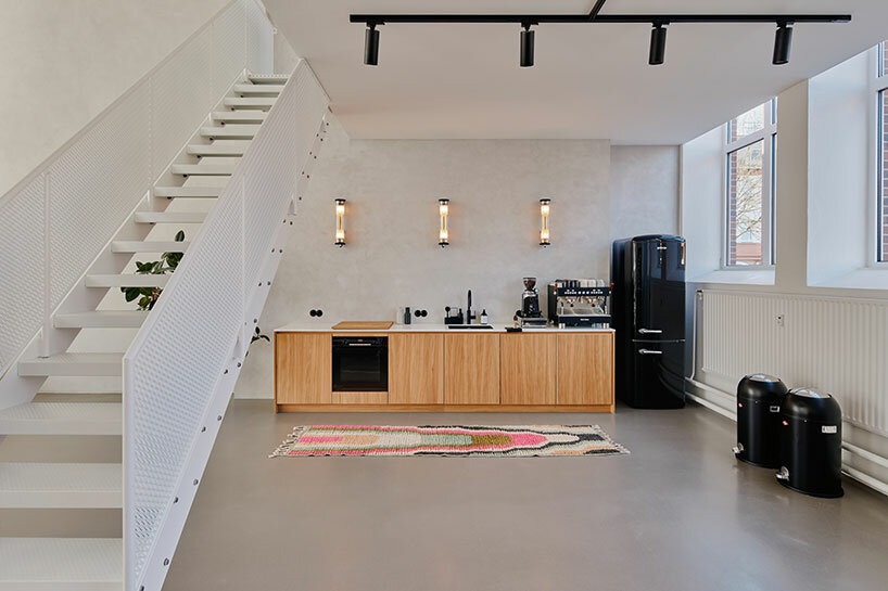 step inside the minimalist interior of hamburg-based kju.studio, captured by david altrath