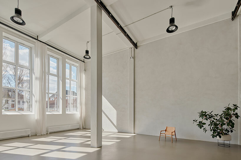 step inside the minimalist interior of hamburg-based kju.studio, captured by david altrath