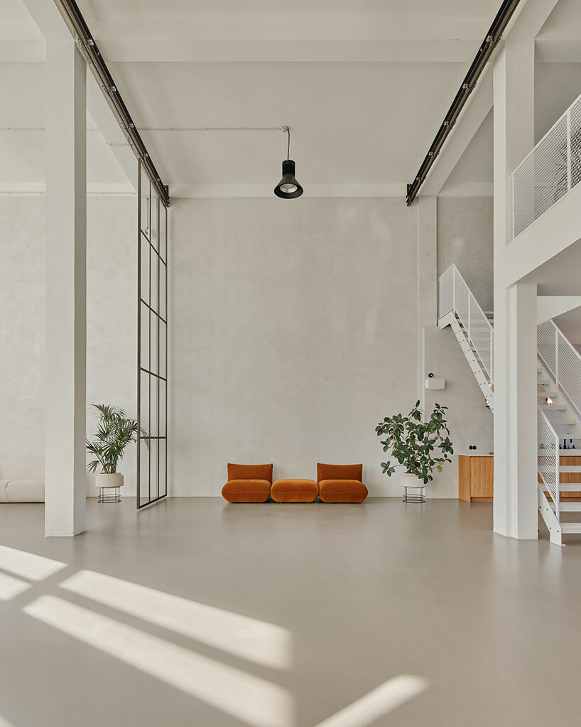 step inside the minimalist interior of hamburg-based kju.studio, captured by david altrath