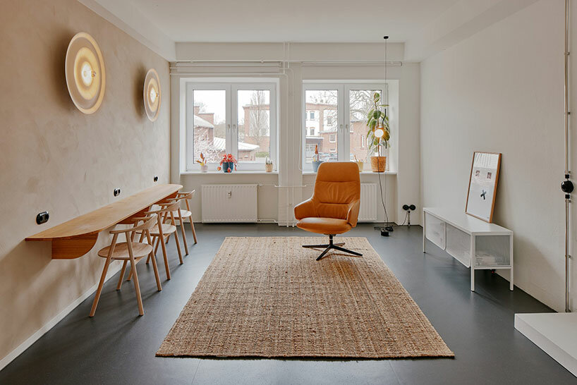 step inside the minimalist interior of hamburg-based kju.studio, captured by david altrath