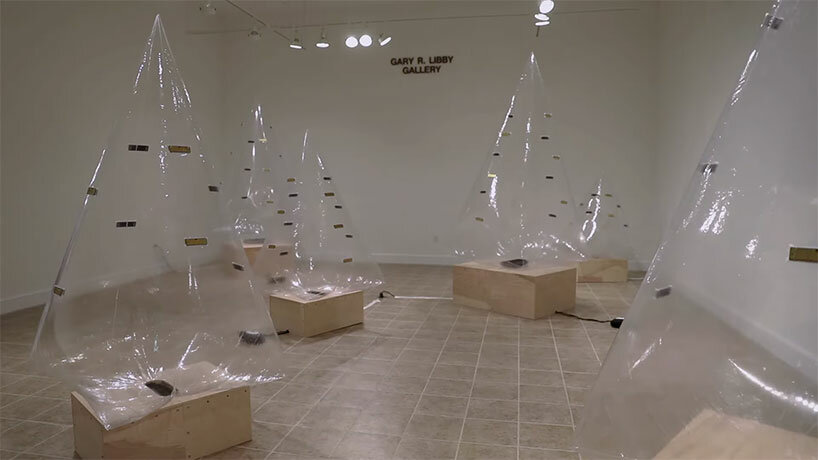 inflatable tree-shaped sculpture by sky macklay plays the harmonica when you hug it