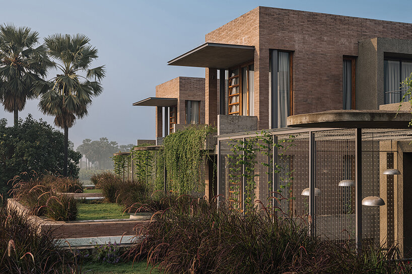 earth brick meets exposed concrete at the nature-infused 'jungalow 2' house in india