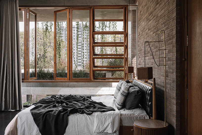 earth brick meets exposed concrete at the nature-infused 'jungalow 2' house in india