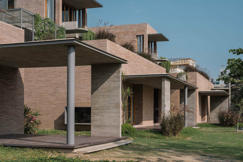 earth brick meets exposed concrete at the nature-infused 'jungalow 2' house in india
