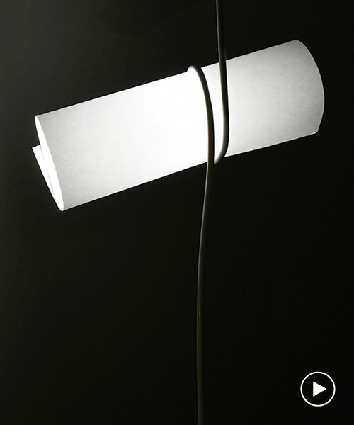 kazuhiro yamanaka fastens roll of A3 paper with power cable for playful lighting fixture
