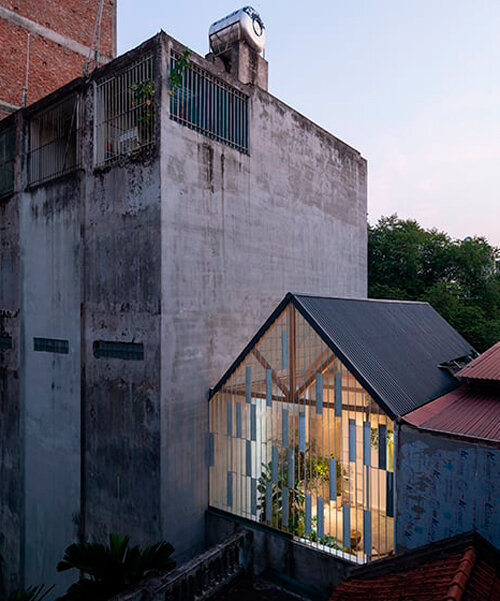 translucent sheets wrap raincoat house's facade and roof in vietnam