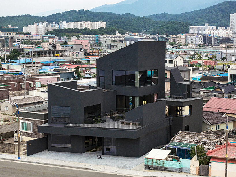 WGNB's SHLTR café in south korea reveals cavernous courtyards and interiors