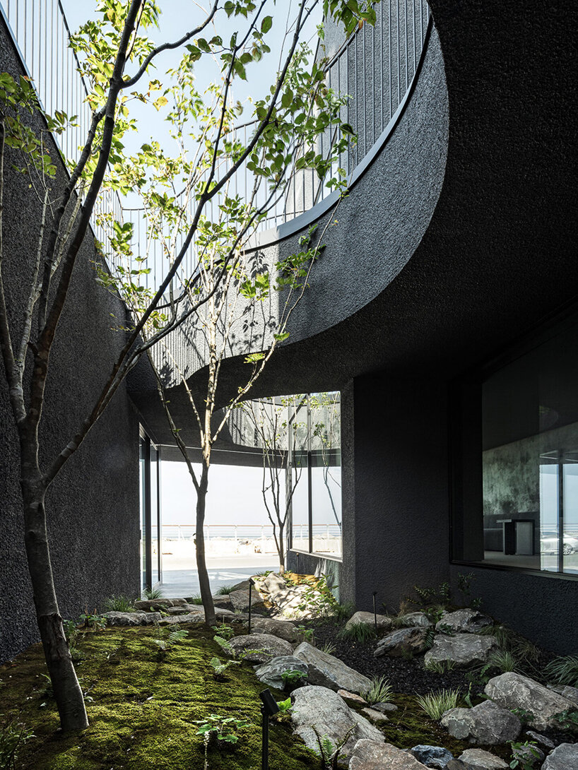 WGNB's SHLTR café in south korea reveals cavernous courtyards and interiors