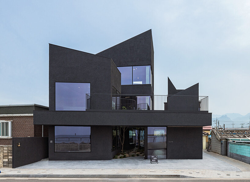 WGNB's SHLTR café in south korea reveals cavernous courtyards and interiors