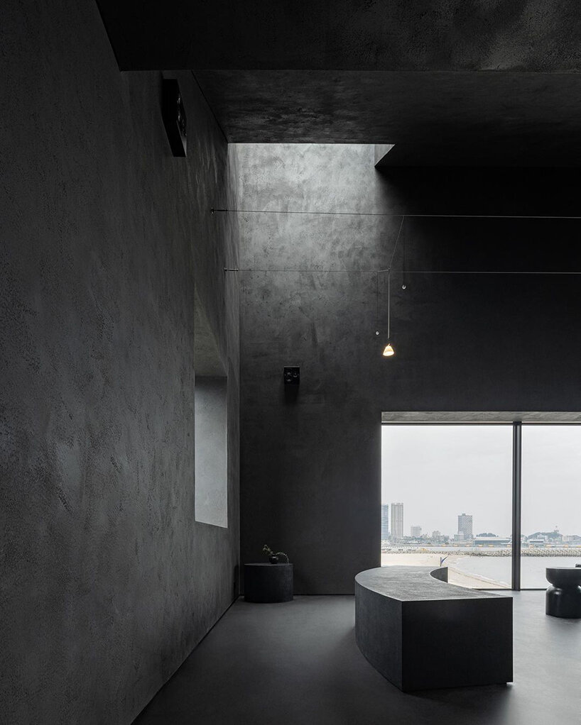 WGNB's SHLTR café in south korea reveals cavernous courtyards and interiors