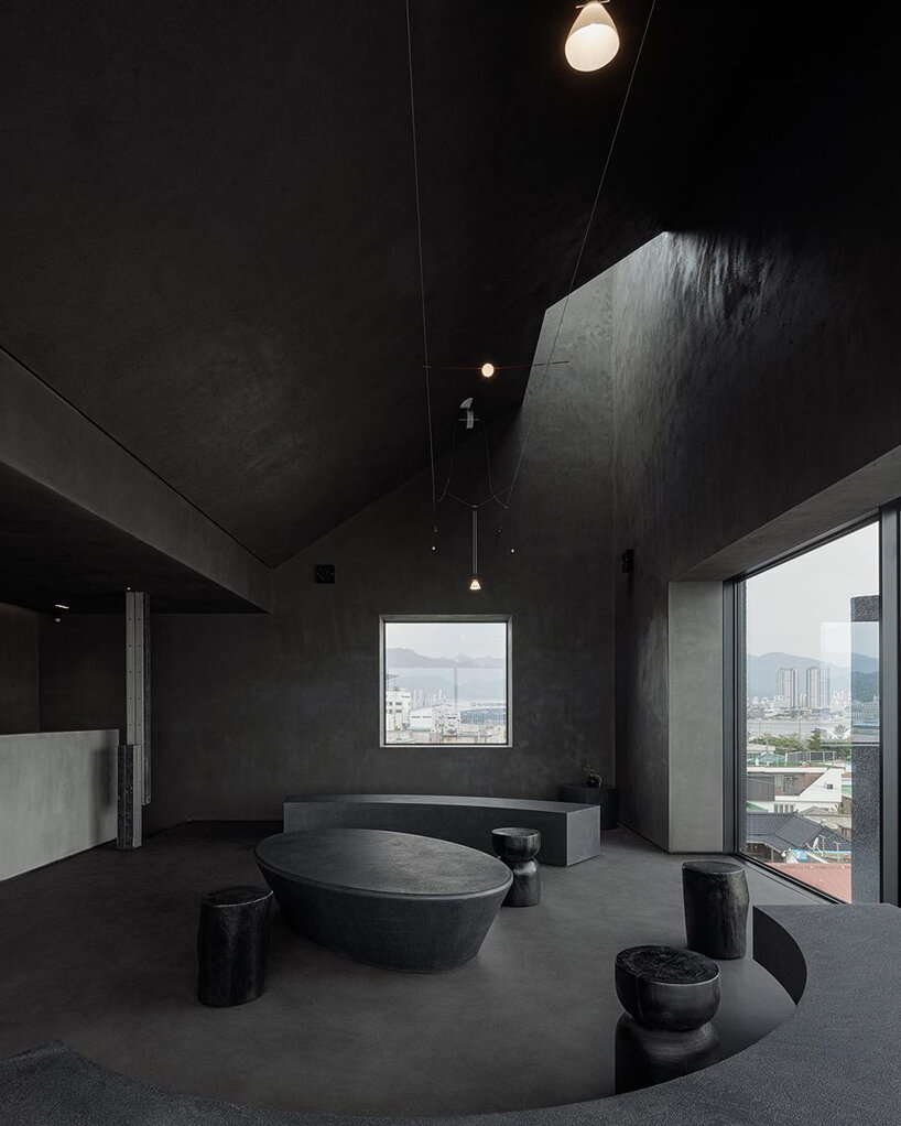 WGNB's SHLTR café in south korea reveals cavernous courtyards and interiors