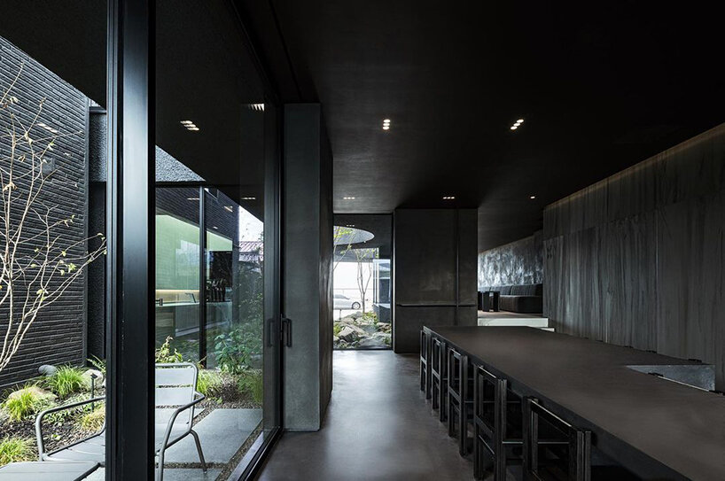 WGNB's SHLTR café in south korea reveals cavernous courtyards and interiors