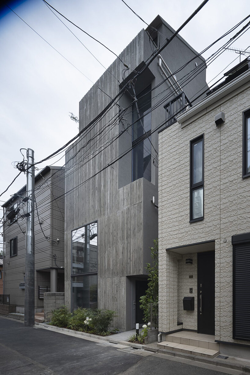 K+S architects fronts home-office in japan with textured concrete evoking geological layers