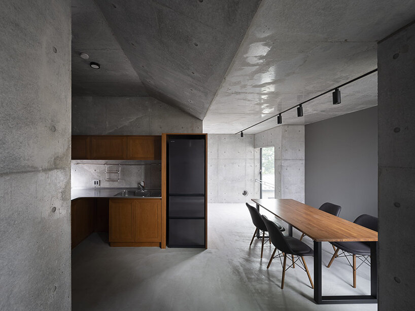 K+S architects fronts home-office in japan with textured concrete evoking geological layers