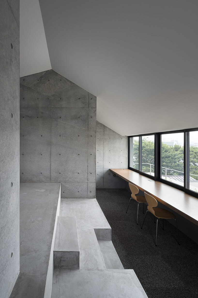 K+S architects fronts home-office in japan with textured concrete evoking geological layers