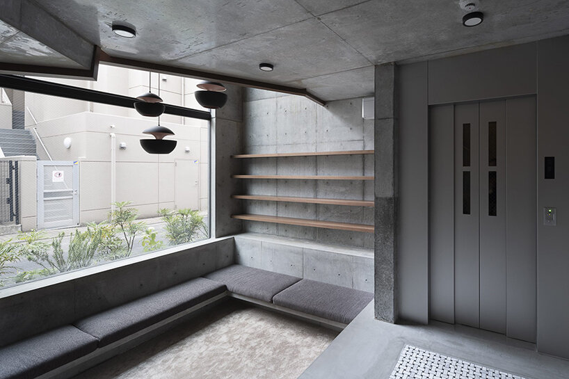 K+S architects fronts home-office in japan with textured concrete evoking geological layers