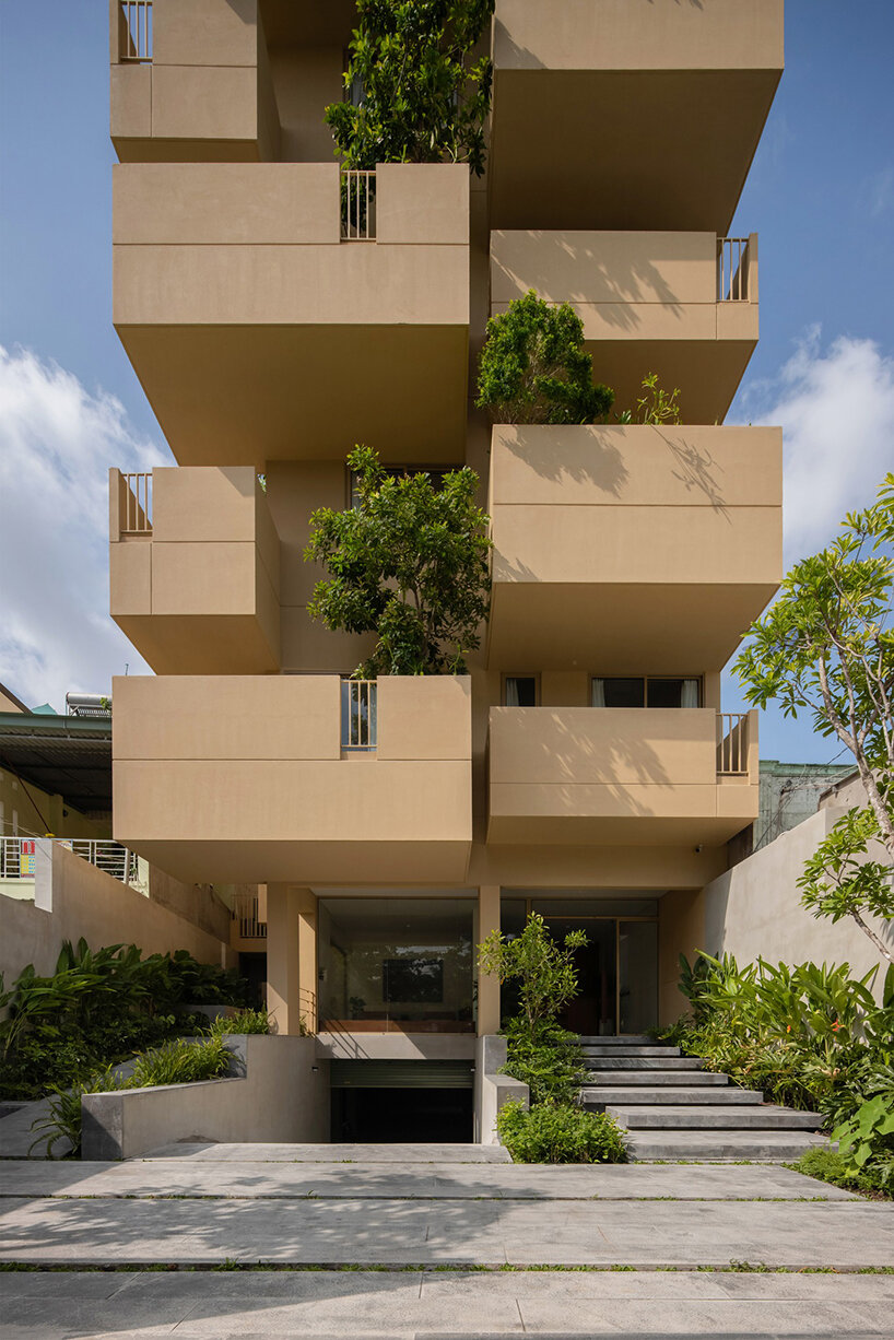 TAA design shapes living complex in vietnam as a matrix of flying blocks & large trees