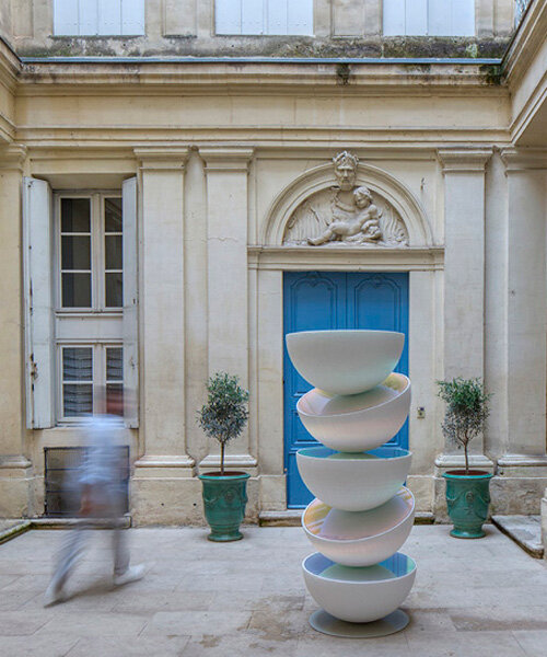 vicente spínola's totem installation stacks reflective semispheres, pondering the climate crisis
