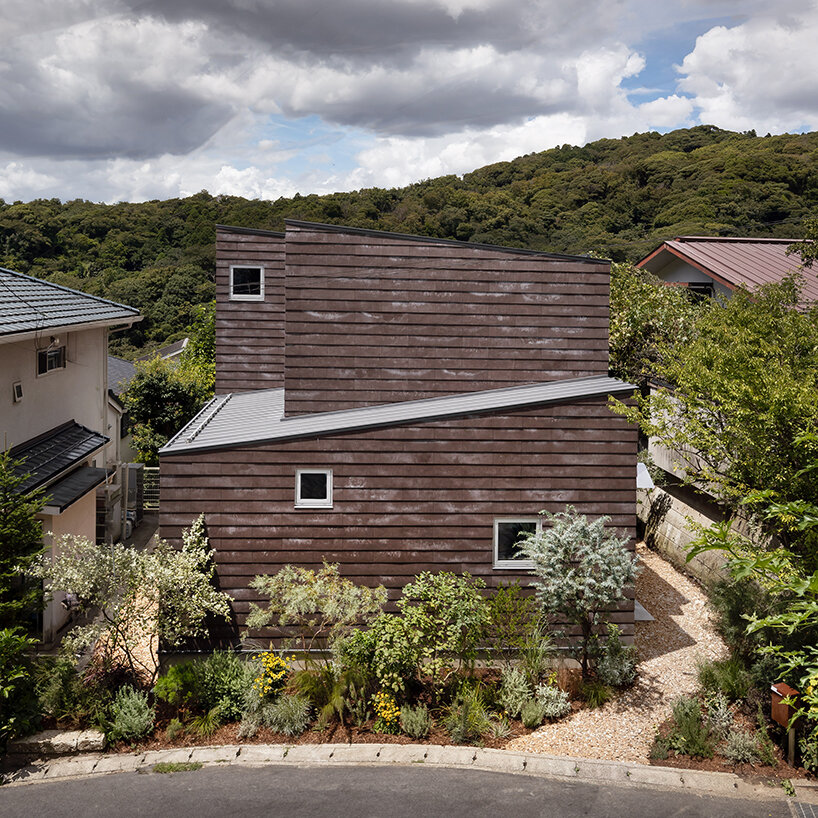 built for cats, tan yamanouchi's japanese home unfolds around a playful spiral staircase