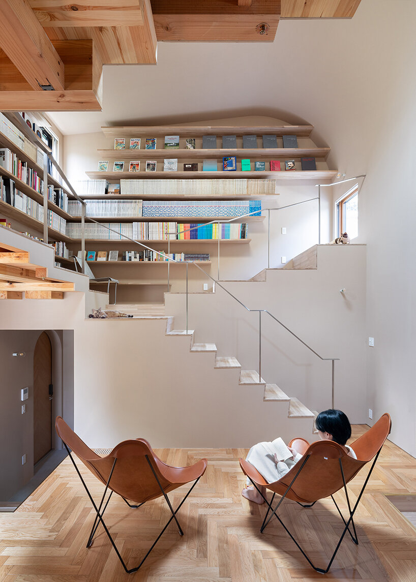 built for cats, tan yamanouchi's japanese home unfolds around a playful spiral staircase