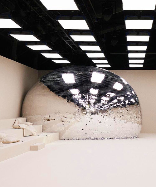 giant disco ball with reflective shards crashed acne studios SS24 women's show in paris