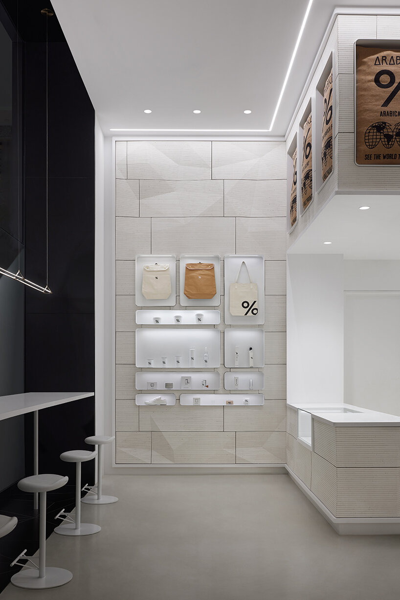 % arabica's flagship in toronto reveals faceted walls inspired by glacial and rock formations