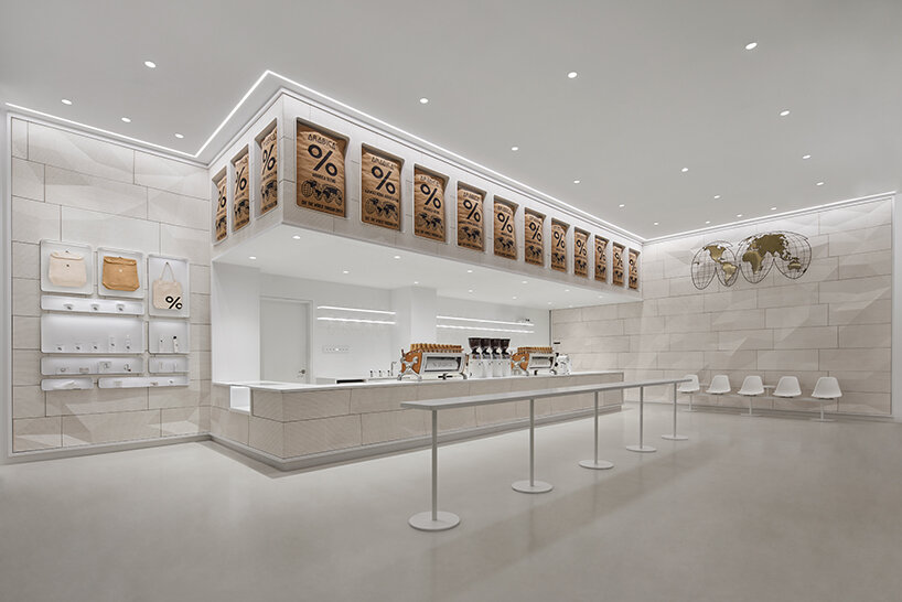 % arabica's flagship in toronto reveals faceted walls inspired by glacial and rock formations