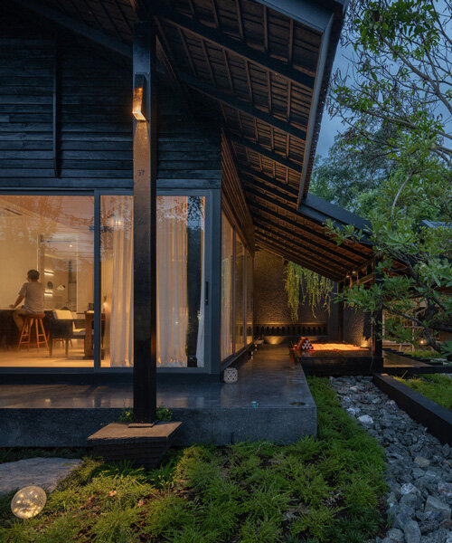 black wooden house in thailand blends contemporary and traditional tectonics