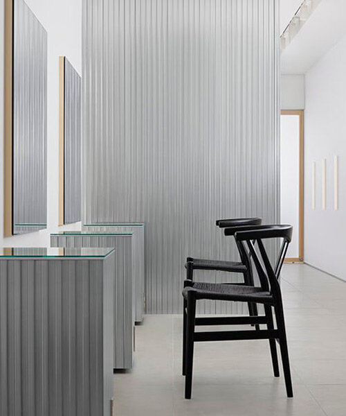 aluminum and polycarbonate plates add an industrial touch to minimal japanese hair salon