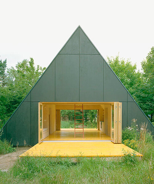 primary colors imbue the wooden A-frame house wolin in poland